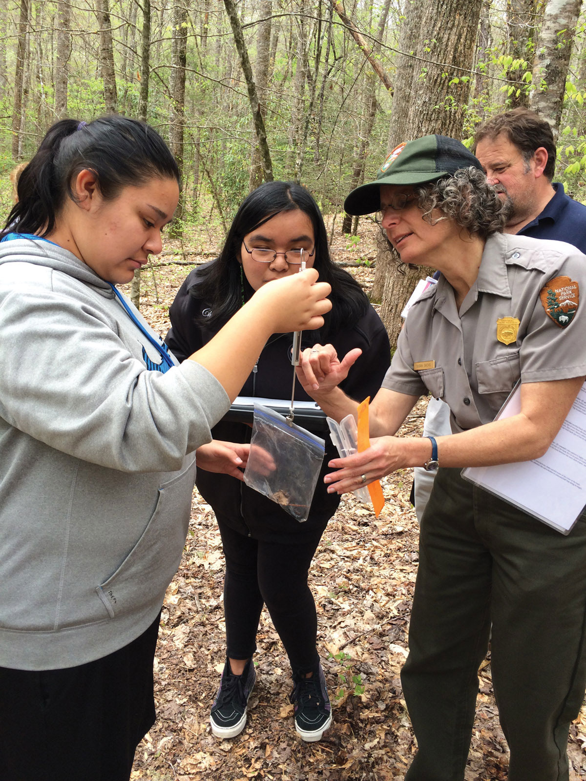 GSMNP Education Branch Coordinator Susan Sachs shows students how to weigh a salamander during a Parks as Classrooms session. Provided by Parks as Classrooms.